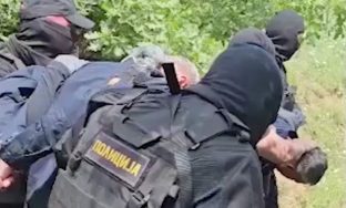 Serbian security forces detain Kosovo police officers in a location given as near Gnjilica, Serbia June 14, 2023 in this screengrab obtained from a handout video. MINISTRY OF INTERNAL AFFAIRS OF SERBIA/via REUTERS  THIS IMAGE HAS BEEN SUPPLIED BY A THIRD PARTY. MANDATORY CREDIT. NO RESALES. NO ARCHIVES. REUTERS WAS NOT ABLE TO INDEPENDENTLY VERIFY THE LOCATION OF THE VIDEO