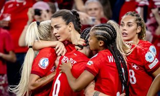 Switzerland's Riola Xhemaili, 2nd left, celebrates with teammates after scoring the 1:1 goal during the UEFA Women's EURO 2025 Group A soccer match between Finland and Switzerland at the Stade de Geneve stadium in Geneva, Switzerland, on Thursday, July 10, 2025. (KEYSTONE/Jean-Christophe Bott)
