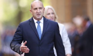 Bulgaria's President Rumen Radev walks with the chairman of Bosnian Presidency Denis Becirovic before official talks in Sarajevo, Bosnia, Wednesday, Oct. 16, 2024. (AP Photo/Armin Durgut)